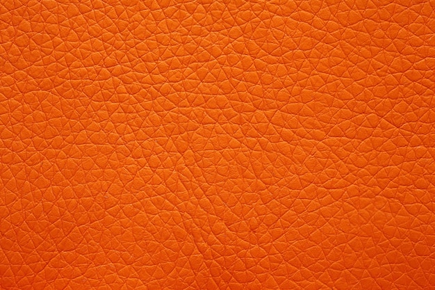 Textura de cuero sintético en magnífico color naranja Fondo de cuero naranja brillante