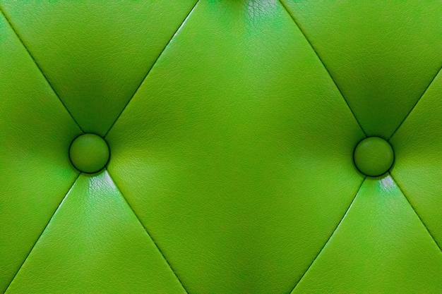 Textura de cuero verde elegante con botones para el patrón y el fondo.