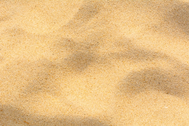 Textura da areia na praia como o fundo.