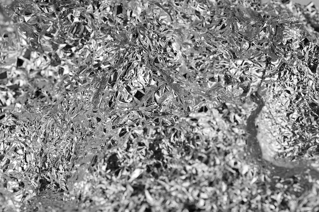 Textura da folha de alumínio amassada da cozinha Fechar a folha de alumínio amassada