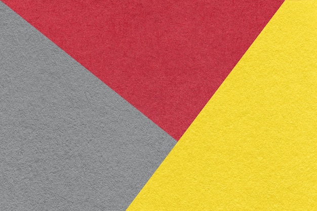 Textura da macro de fundo de papel de cor cinza vermelha e amarela de artesanato Estrutura de papelão abstrato vintage