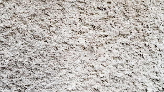 Textura da parede de concreto. Fundo de parede de estuque branco. Parede de cimento pintado de branco. Parede e piso de concreto branco como textura de fundo. Loft no estilo de idéias de design de um edifício residencial.