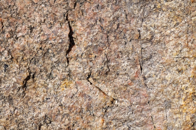 Textura da superfície da pedra do granito. Textura de fundo de superfície de pedra de granito áspero. Fundo abstrato de material natural