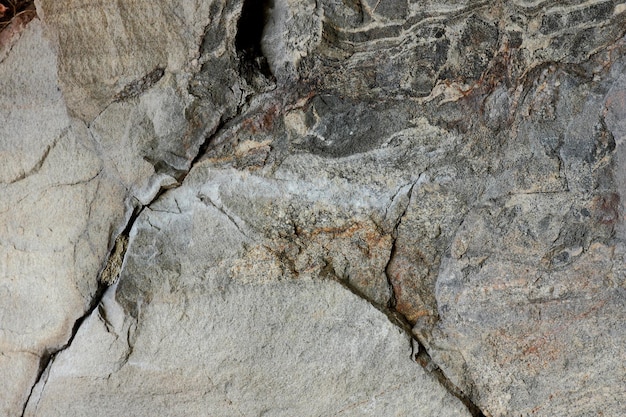 Textura da superfície resistida da rocha de pedra antiga Detalhe da natureza das rochas Parede de pedra marrom áspera fechada