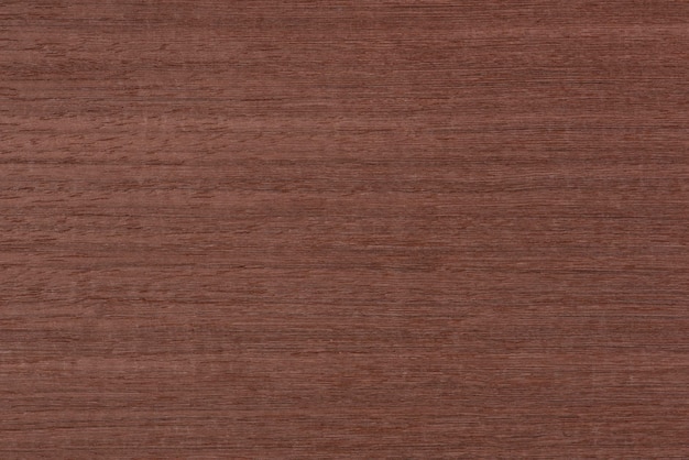 Textura da textura de mogno da madeira koto com tonalidade marrom avermelhada, madeira rara exótica da áfrica para