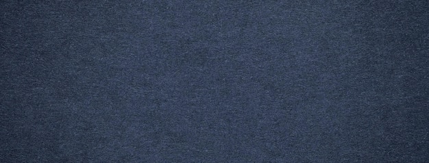 Textura da velha macro de fundo de papel de cor azul marinho Estrutura de um papelão vintage de denim escuro