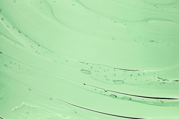 Textura de amostra cosmética transparente de gel creme com fundo de bolhas