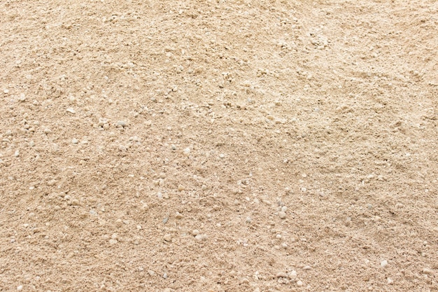 Textura de areia amarela com pequenos grãos visíveis.