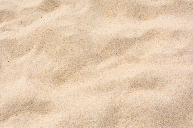 Foto textura de areia na praia como pano de fundo