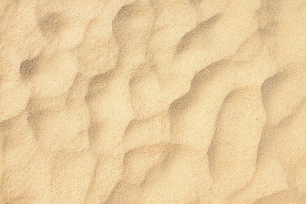 Textura de areia. Praia de areia para segundo plano. Vista do topo