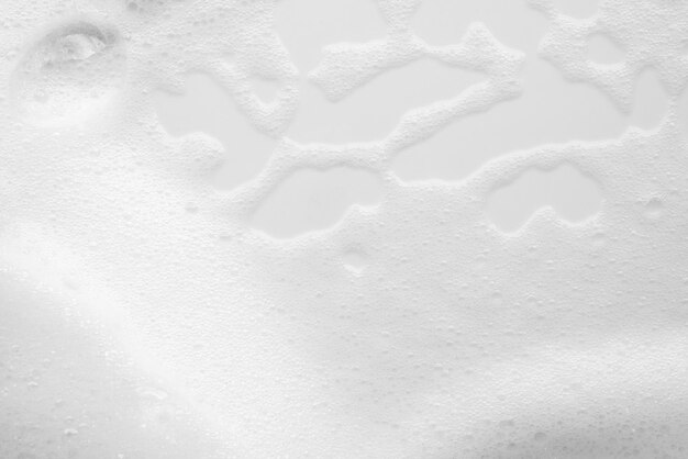 Foto textura de bolhas de espuma de sabão branco abstrato em fundo branco