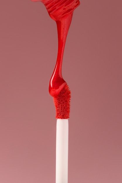 Textura de brilho labial vermelho em estúdio