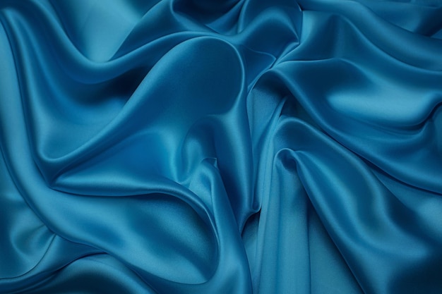 Textura de close-up de tecido azul natural ou tecido da mesma cor. Textura de tecido de algodão natural, seda ou lã, ou material têxtil de linho. Fundo de tela azul.