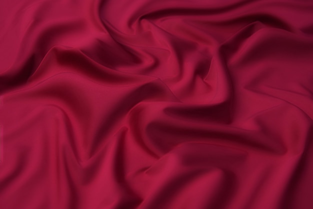Textura de close-up de tecido vermelho ou laranja natural ou pano da mesma cor.