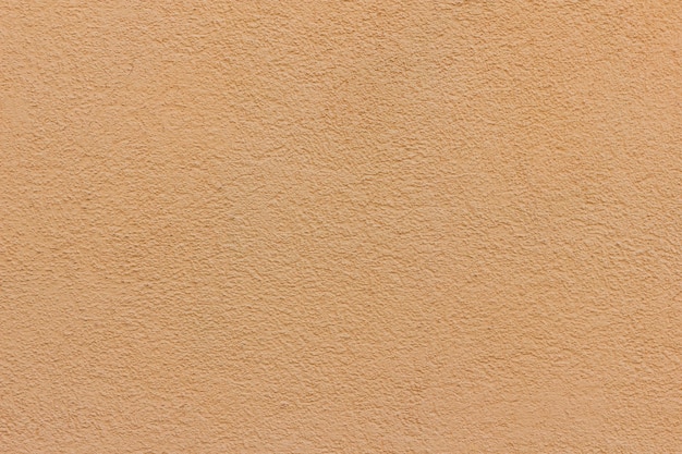 Textura de concreto. Fundo de parede de cor pêssego com espaço de cópia.