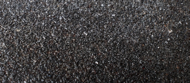 Textura de cor cinza escuro de asfalto de lixa close up