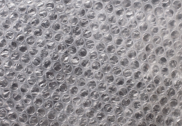 Textura de embalagem de polietileno em um fundo de plástico bolha