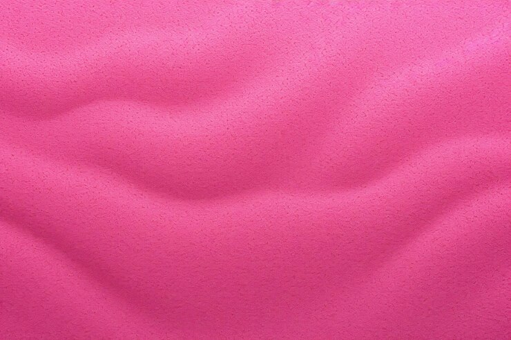 Foto textura de fundo de areia magenta com espaço de cópia para texto ou produto
