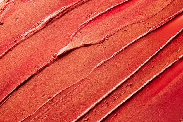 Textura de fundo de batom vermelho brilhante manchada