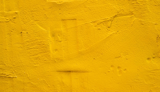 Textura de fundo de concreto amarelo velho sujo