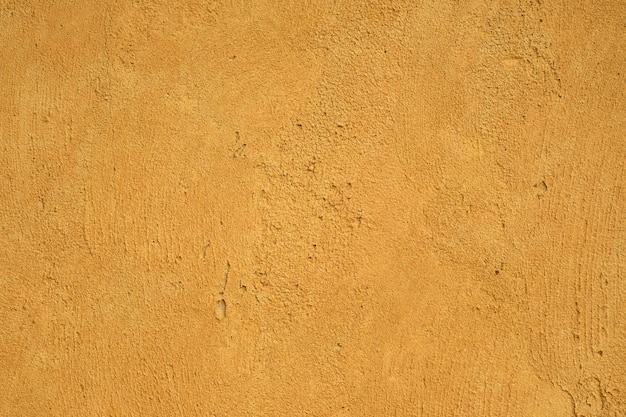 Textura de fundo de concreto amarelo velho sujo