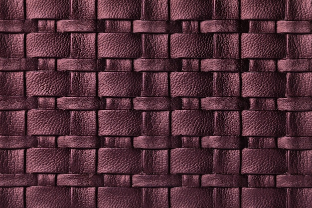 Textura de fundo de couro roxo escuro com padrão de vime