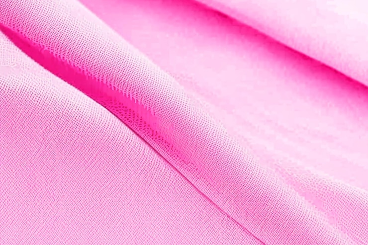 Foto textura de fundo de estúdio de tecido de algodão vermelho carmesim ou rosa natural com gradiente