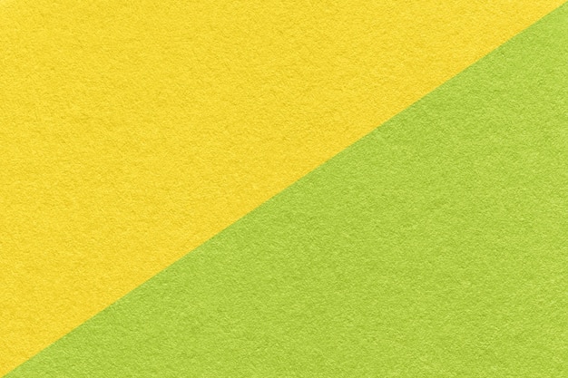 Textura de fundo de papel amarelo e verde artesanal metade de duas cores macro Estrutura de papelão vintage