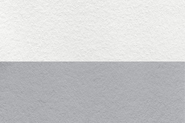 Textura de fundo de papel branco e cinza artesanal metade de duas cores macro Estrutura de papelão cinza denso vintage