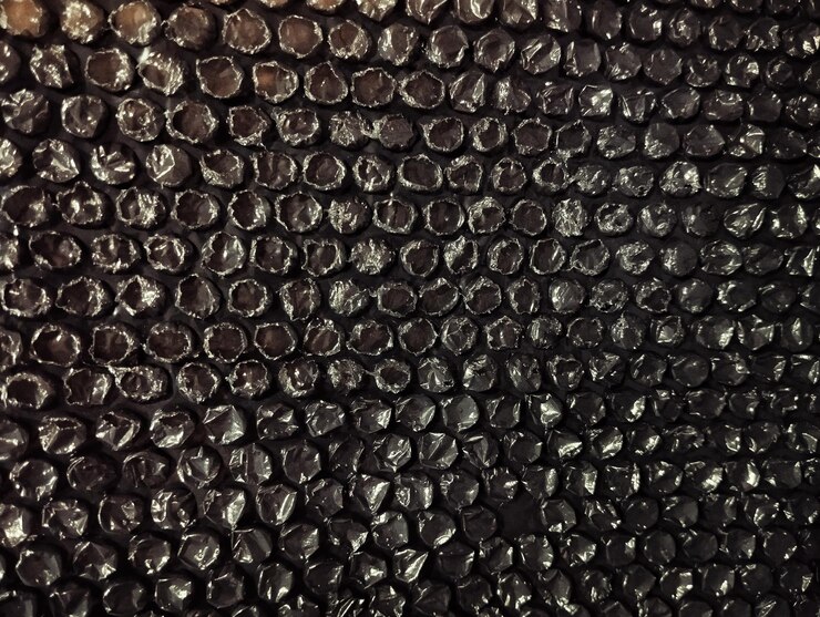 Foto textura de fundo de papel de parede plástico estético preto com envoltura de bolha