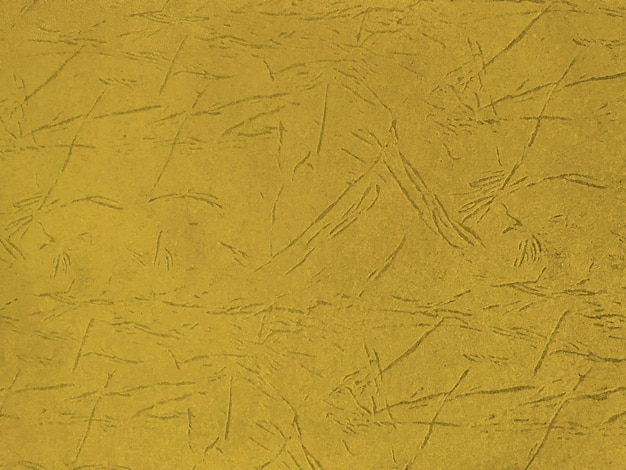 Textura de fundo de papel dourado escuro velho, closeup. estrutura de papelão amarelo artesanal denso.