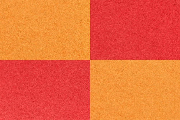 Textura de fundo de papel laranja e vermelho brilhante artesanal com macro de padrão de células Papelão de rubi kraft denso vintage