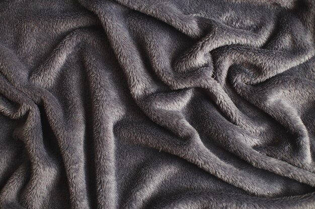 Textura de fundo de tecido de pelúcia cinza enrugada padrão de material macio