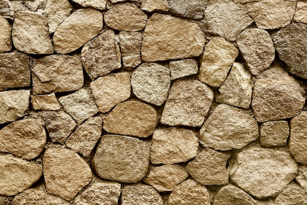 Foto textura de fundo velho muro de pedra bege