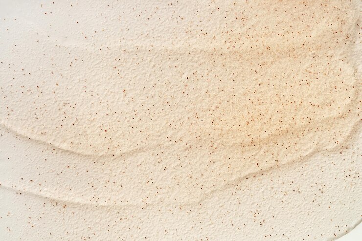 Foto textura de gel de beleza com partículas fundo bege com pinceladas e partículas