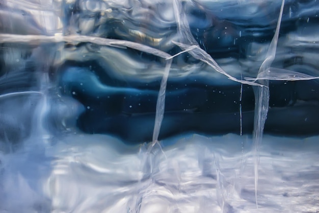 Foto textura de gelo rachaduras baikal, fundo abstrato gelo de inverno transparente azul