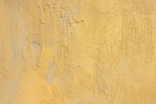 Textura de gesso amarelo áspero. Abstrato arquitetônico.