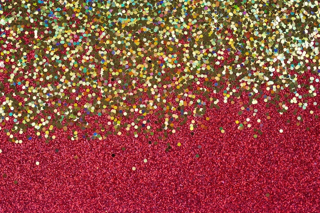 Textura de glitter, fundo vermelho e dourado brilhante