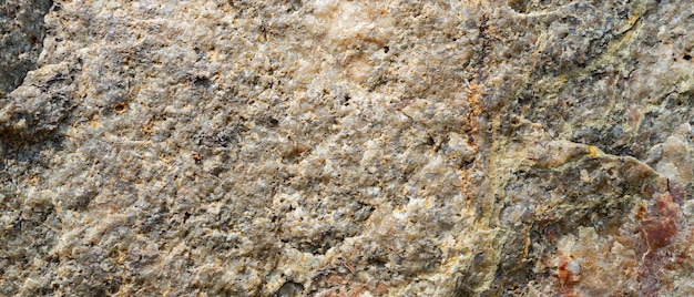 Textura de granito. Superfície de granito áspero, superfície de cristal de pedra natural. Fundo de granito de pedra natural. Copie o espaço