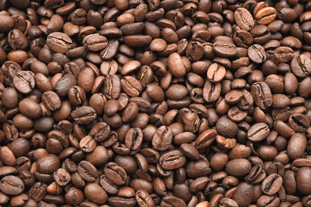 Textura de grãos de café. Grãos de café marrons. Grãos de café torrados, podem ser usados como pano de fundo.