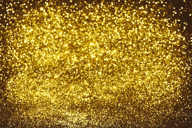 Textura de iluminação de brilho dourado Fundo abstrato desfocado para aniversário de aniversário casamento véspera de ano novo ou Natal