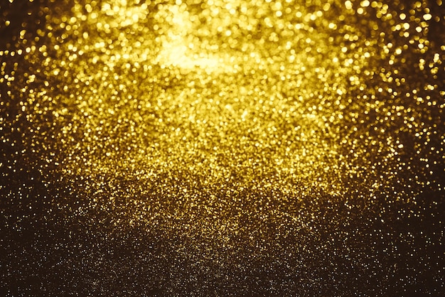 Foto textura de iluminação de brilho dourado fundo abstrato desfocado para aniversário de aniversário casamento véspera de ano novo ou natal