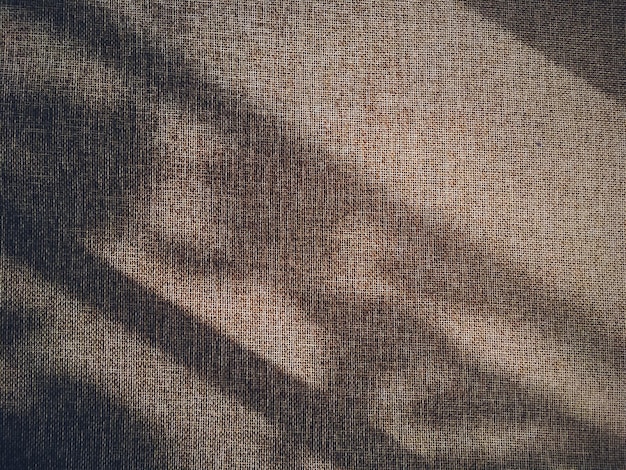 Textura de linho e sombras como plano de fundo rústico