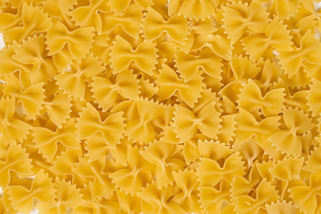 Textura de macarrão cru macarrão comida italiana fundo macro