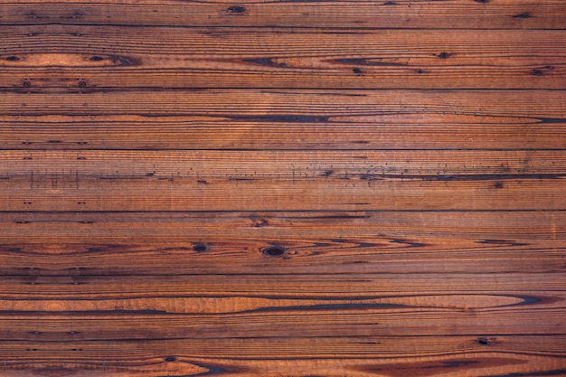 Textura de madeira. A superfície do escuro, o fundo de madeira natural marrom para design decoratio