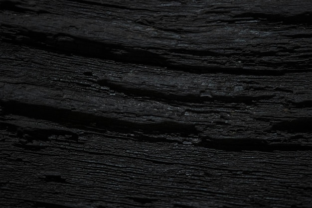 Textura de madeira velha preta Aproximação da textura de carvalho negro profundo Textura de madeira sinuosa com sombra