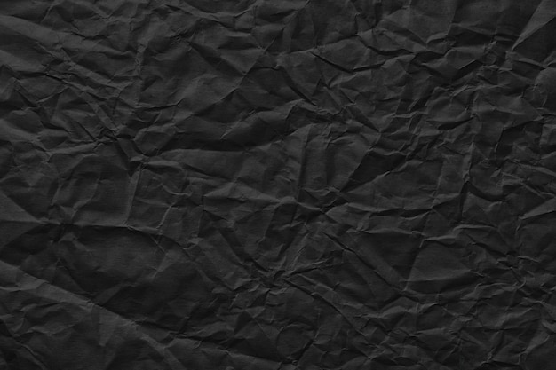 Textura de modelo amassada de fundo de papel preto para inserir texto