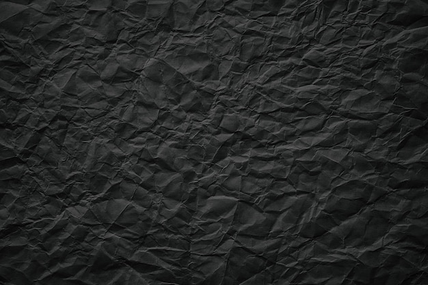 Textura de modelo amassada de fundo de papel preto para inserir texto