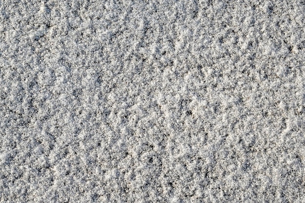 Textura de neve vista superior da neve no asfalto Textura para design