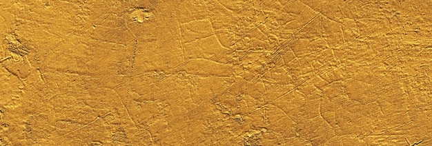 Textura de ouro para o fundo da parede amarela do grunge
